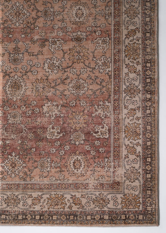 Beige contemporary area rug with ornate medallion pattern and decorative border