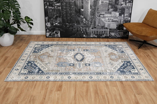 Contemporary area rug with light beige center and blue medallion border pattern
