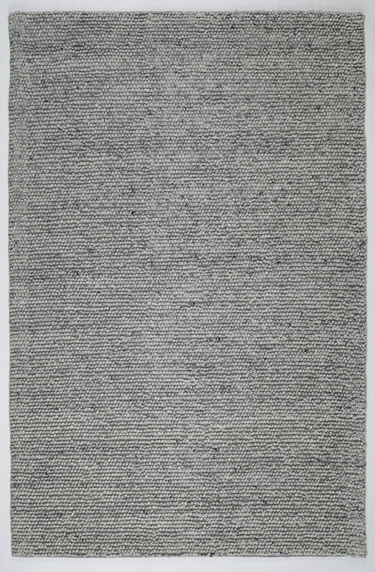 Grey textured area rug with dense speckled weave and subtle texture