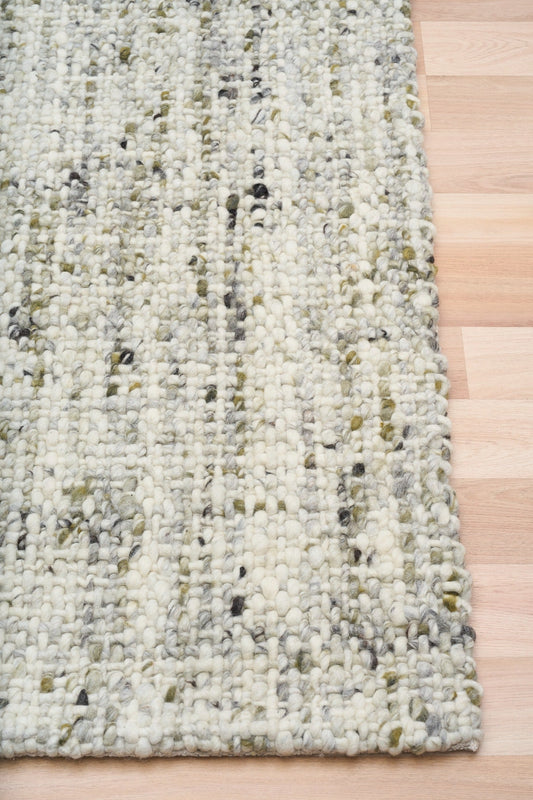 Cleo Green rug with cream, gray, and green speckled woven texture