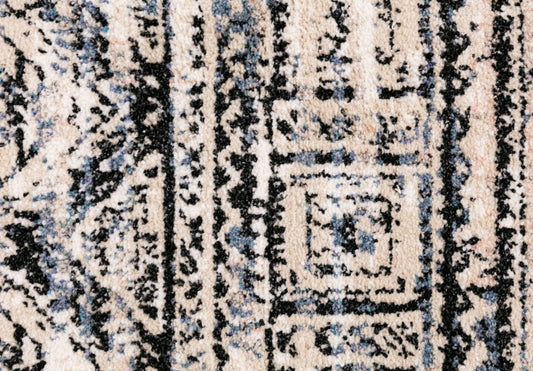 Rug surface close-up with ivory, beige, and navy-blue vertical pattern detail