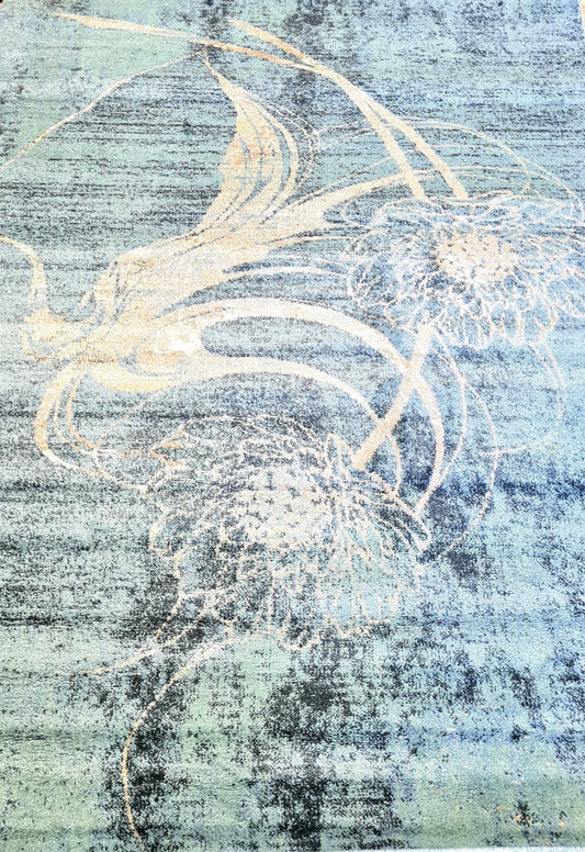 Blue rug close-up with distressed abstract swirls and speckled texture