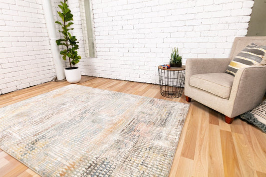 Modern area rug laid flat with multicolor abstract design and soft low pile