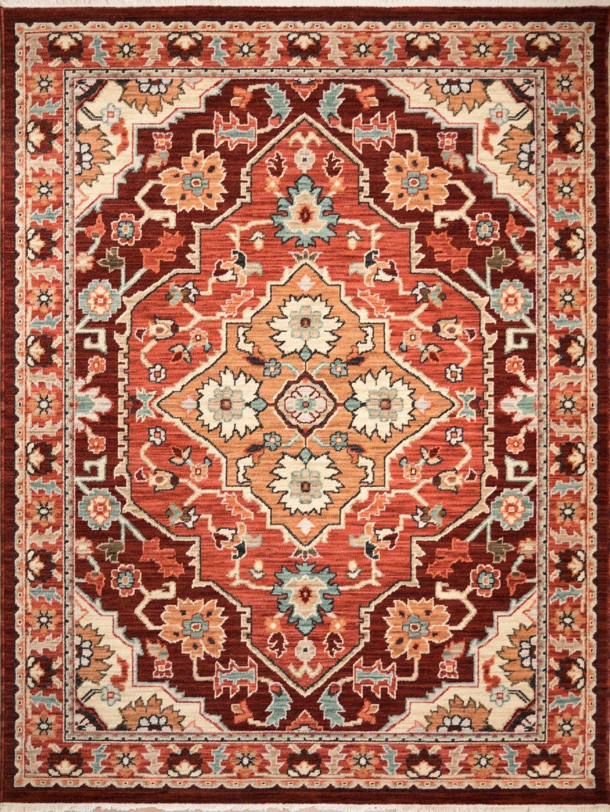Wool rug with ornate red, cream, and navy floral medallion pattern