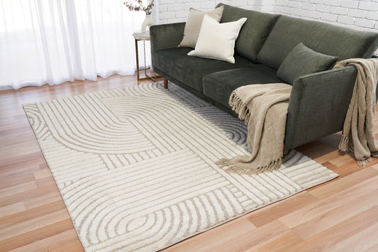 Ivory-beige geometric area rug with wavy line pattern and textured pile
