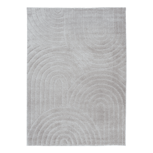 Light grey shag rug with layered wave and circle pattern, straight-on view