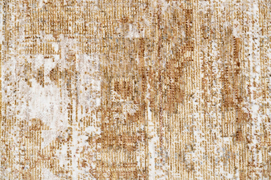 Beige floor rug with mottled ivory and brown distressed woven texture