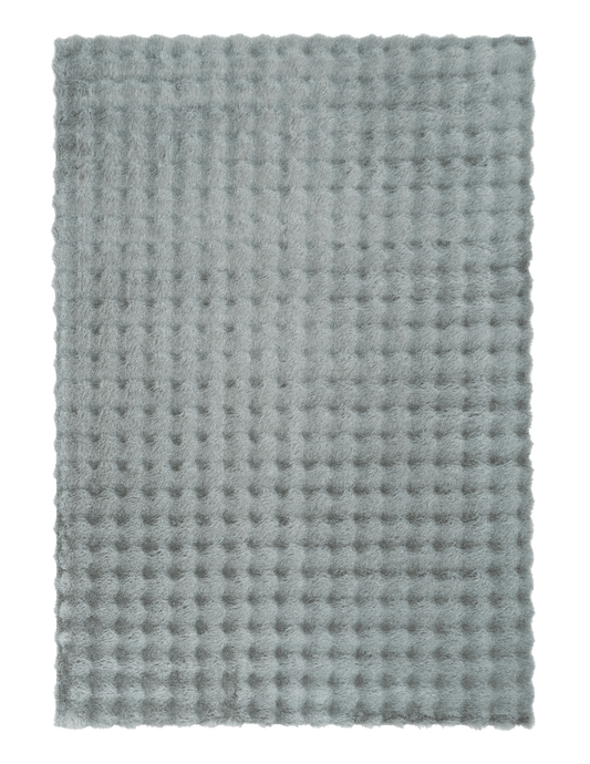 Light gray-green shag rug featuring a raised waffle-dot texture and stitched border