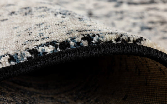 Rug edge close-up with black border and textured woven backing | Raffia carpet 1805 Black Vintage Traditional Living Room Rug - Rugs Point Australia
