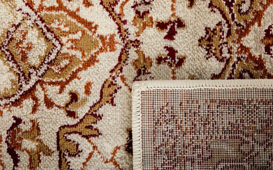 Rug corner detail with cream base, brown and rust motifs, and stitched border edge | Raffia Rug 1802 Terra Modern Polypropylene Area Rug - Rugs Point Australia