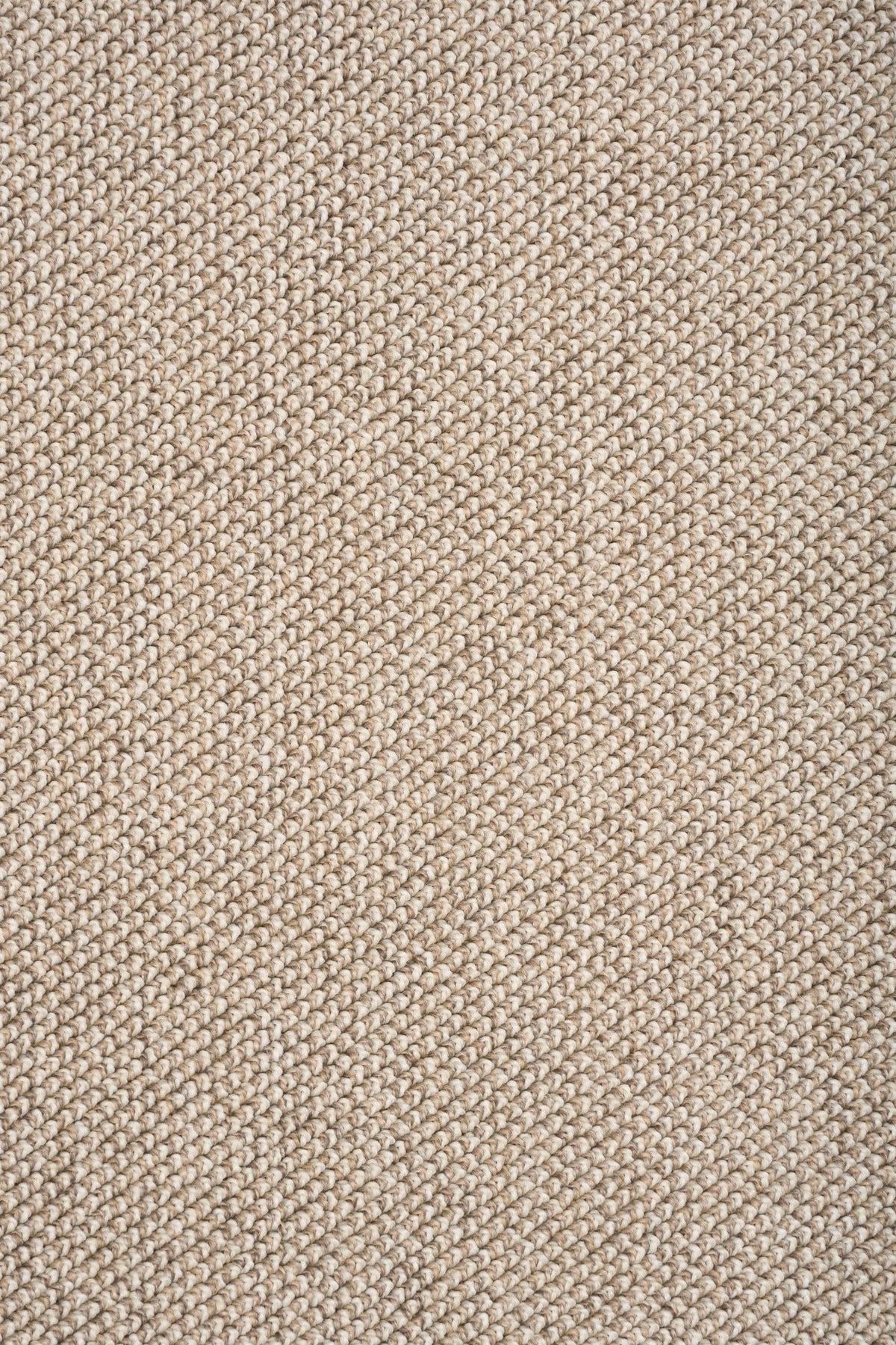 Light brown textured rug weave close-up with fine looped pattern