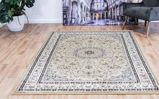 Traditional area rug with light beige base, ornate border and detailed medallion pattern