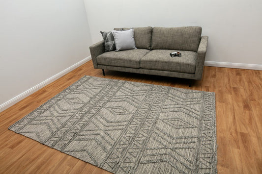 Grey geometric wool rug with diamond and chevron line design