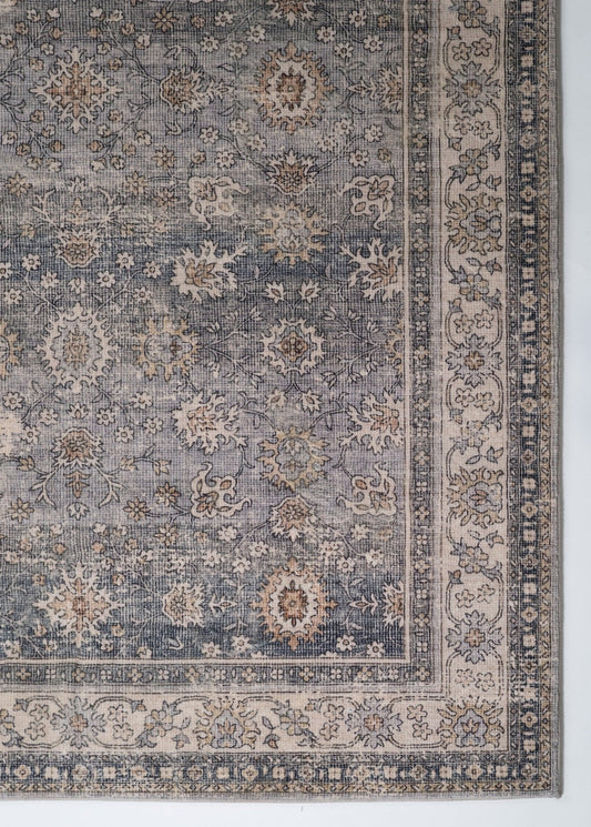 Grey contemporary area rug with ornate floral medallion pattern and detailed border