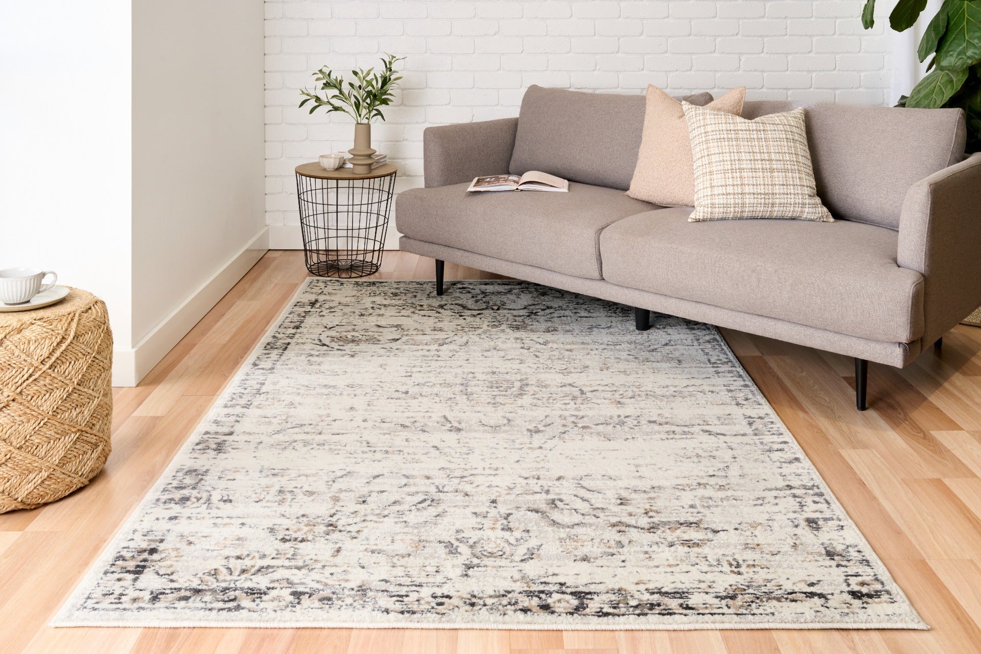 Light gray area rug with distressed abstract pattern and fringeless edge, rectangular