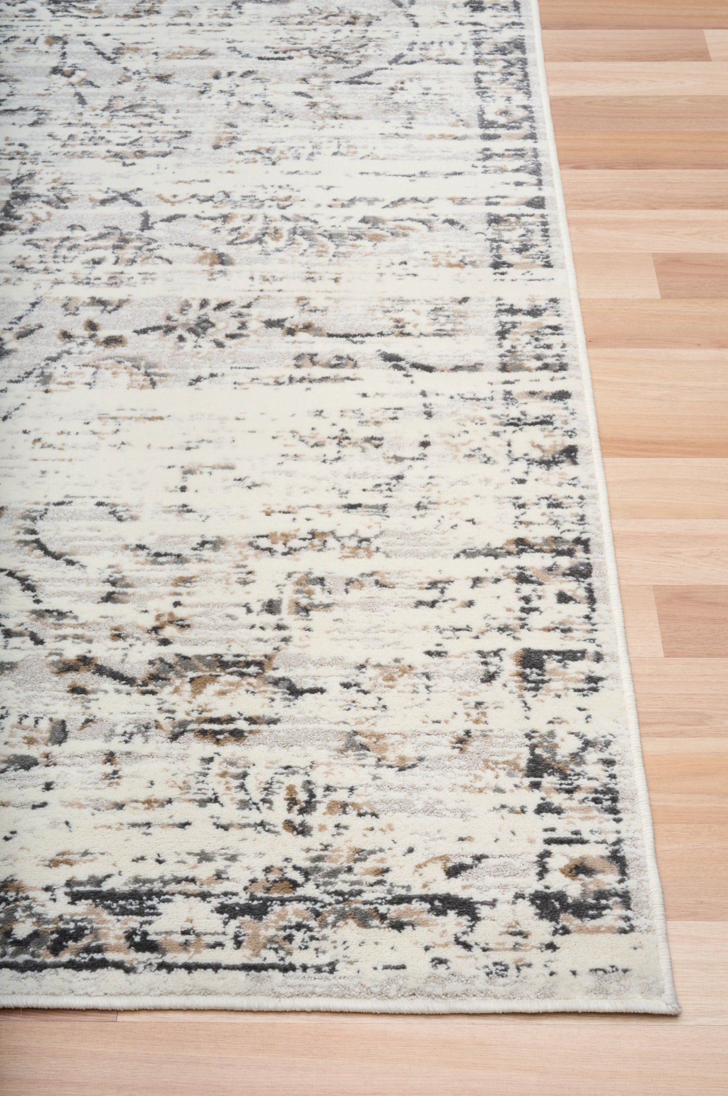 Light gray distressed abstract area rug, rectangular with visible woven texture