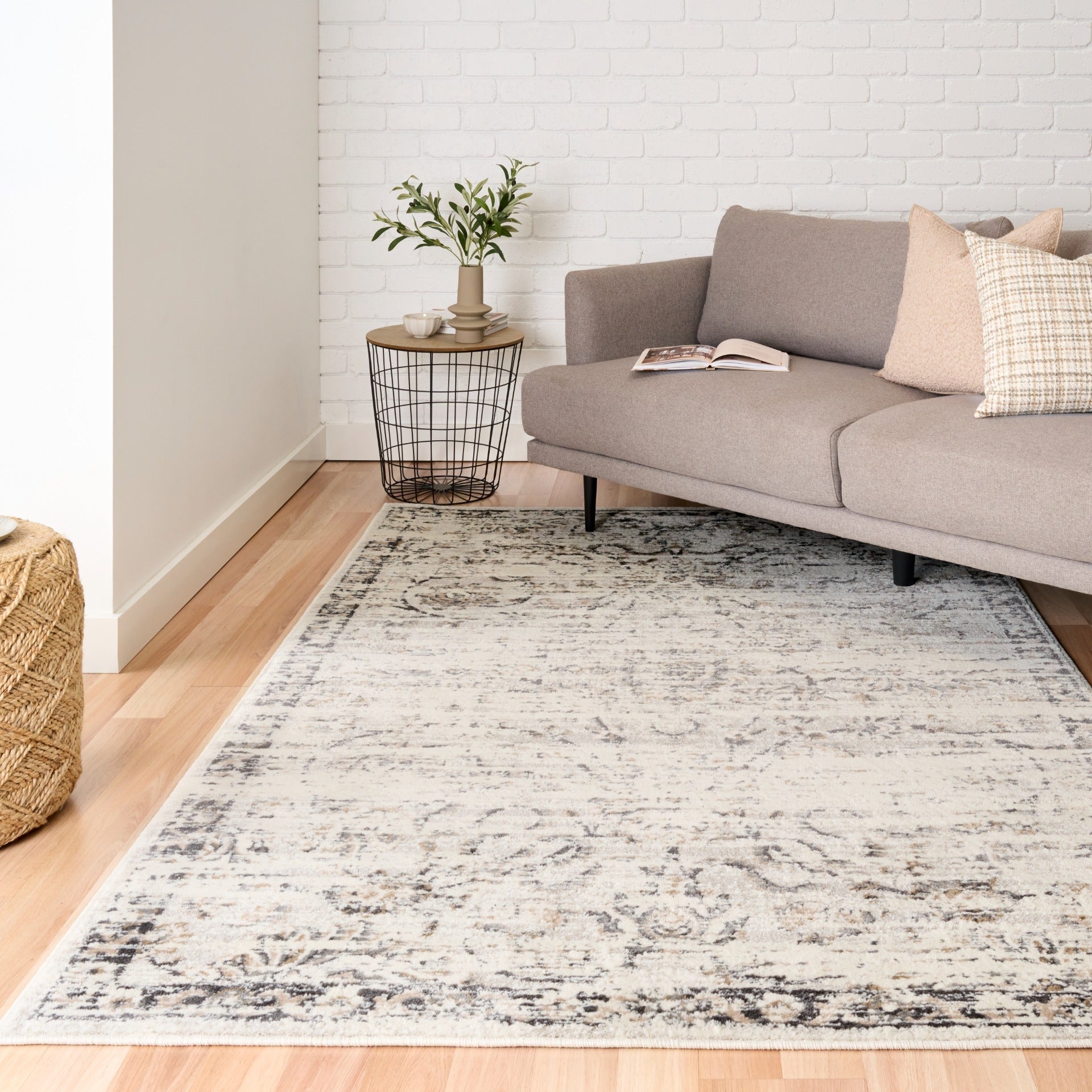 Light gray distressed abstract area rug with rectangular shape and woven texture