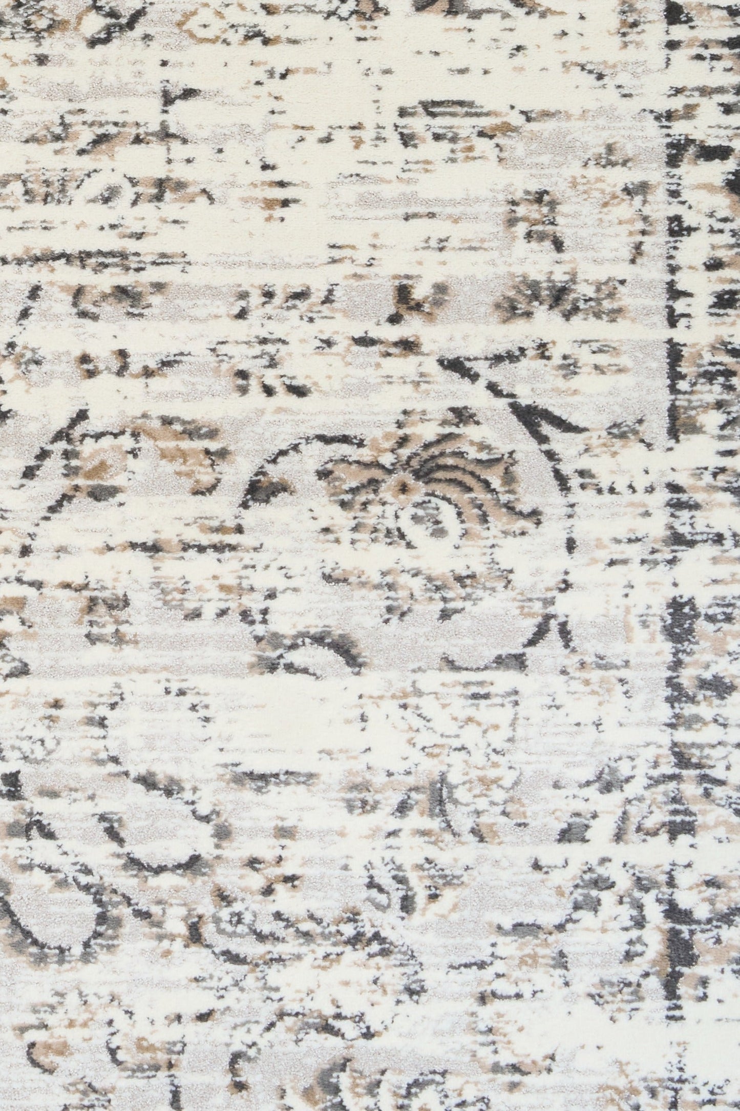 Detail view of light gray distressed abstract area rug with ornate motif accents