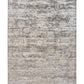 Rectangular distressed light gray area rug with cream abstract surface pattern