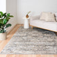 Distressed light gray area rug with cream abstract pattern, short pile