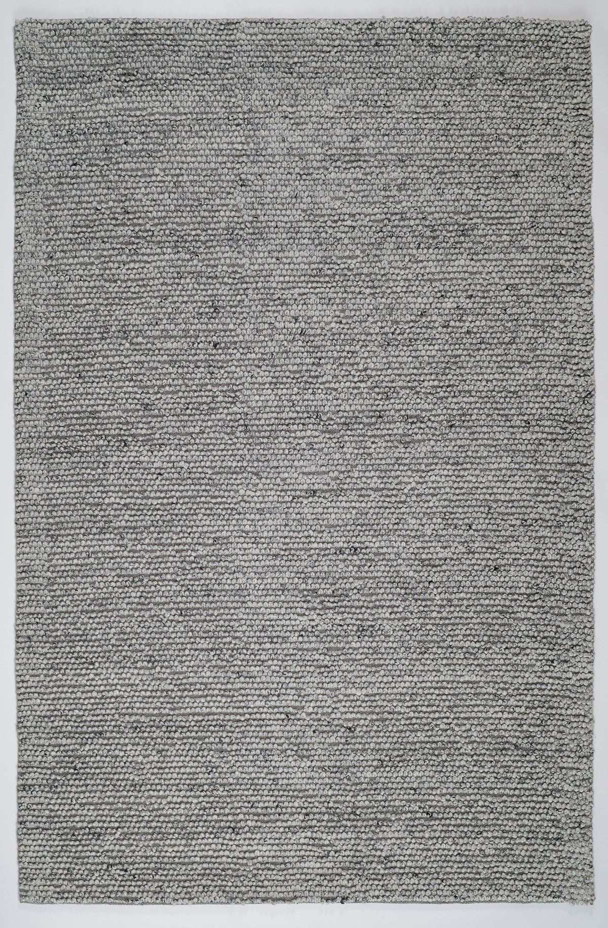 Grey textured area rug with dense speckled weave and subtle texture