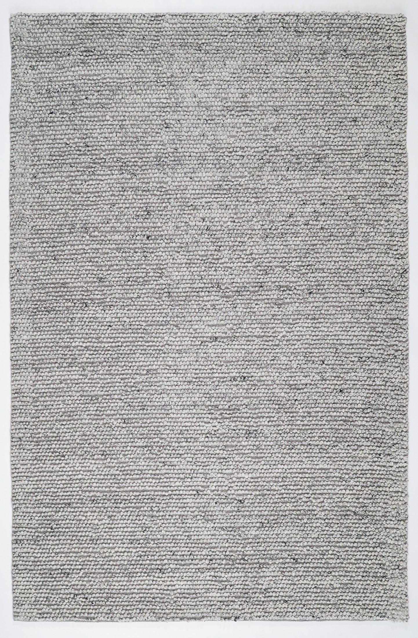 Grey textured area rug, tight speckled woven pattern