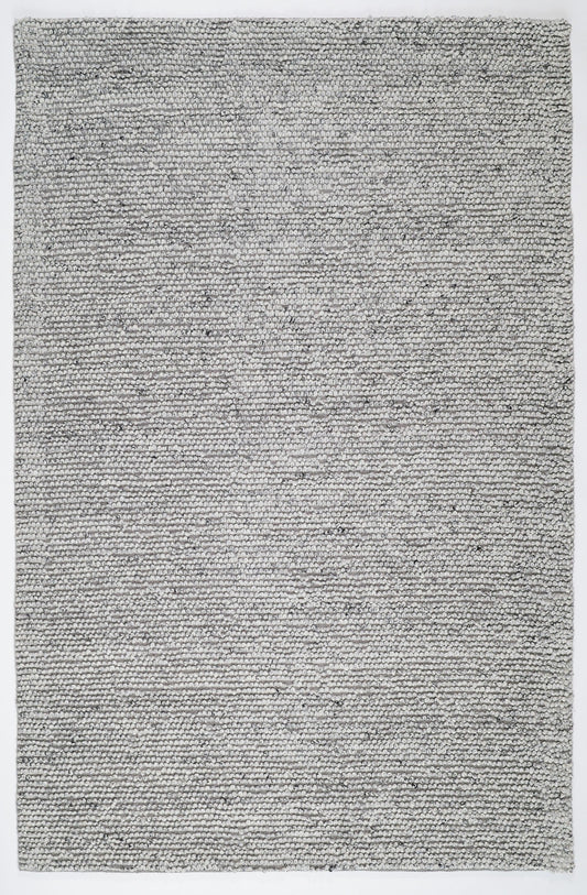 Grey textured area rug, tight speckled woven pattern