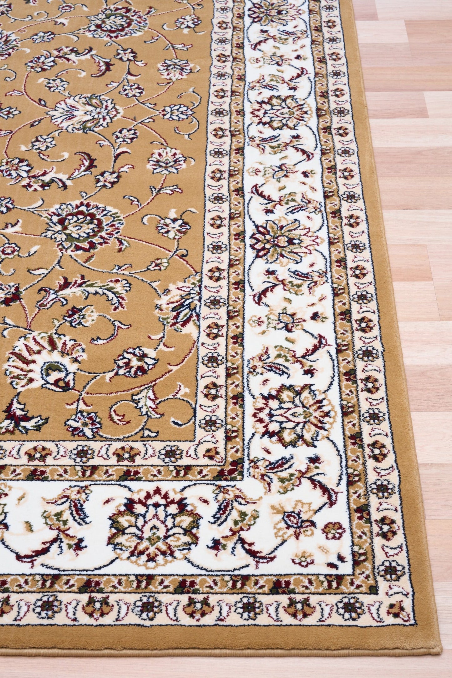 Berber-style area rug corner detail, tan field with floral medallions and cream frame