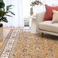 Berber-style area rug with tan floral pattern, cream border stripes, and medallion center