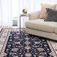 BALUCHI navy area rug with floral vine motif and cream border stripes