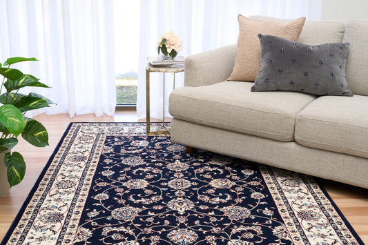 BALUCHI navy area rug with floral vine motif and cream border stripes