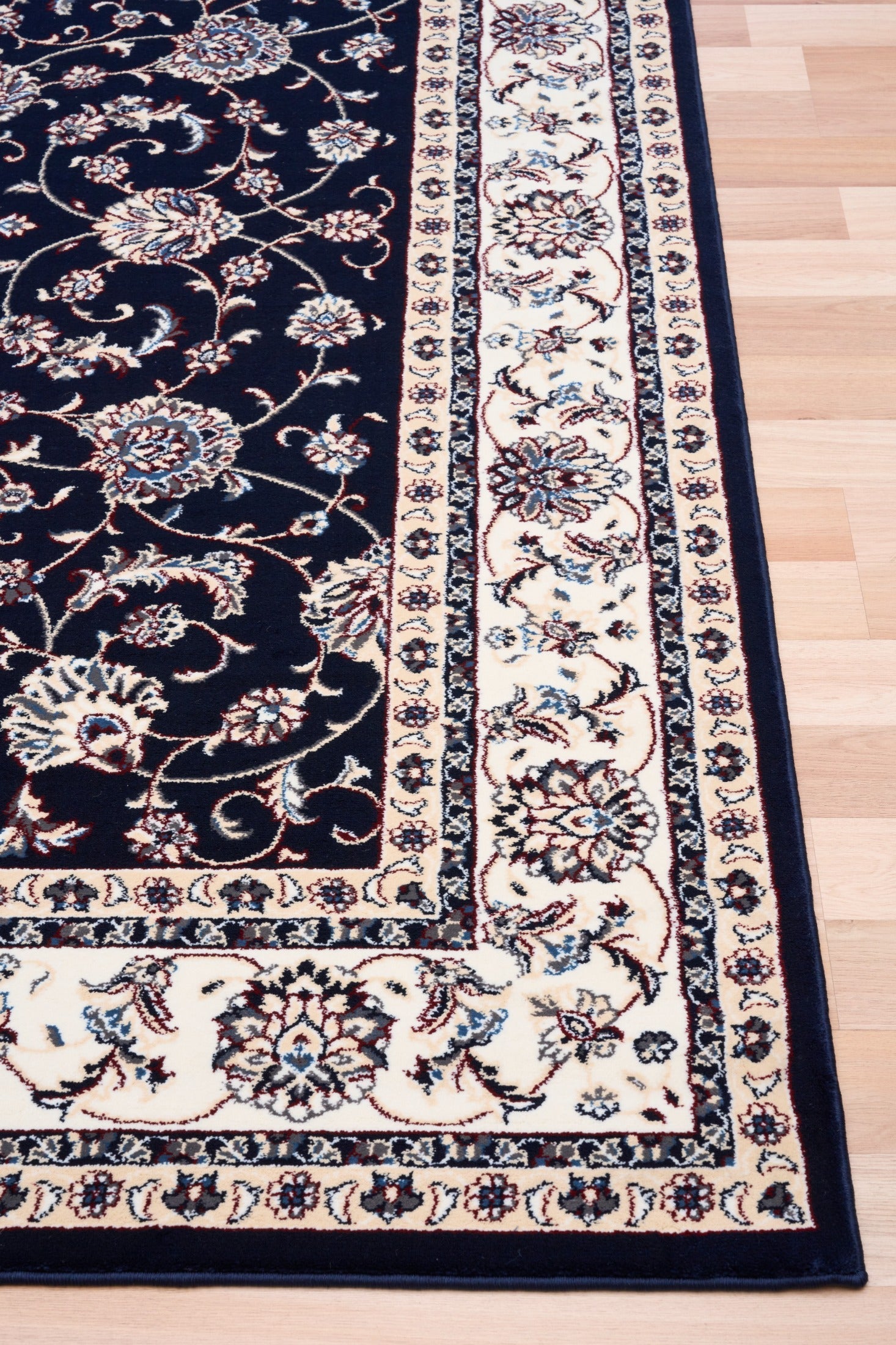 BALUCHI navy area rug with floral vine pattern, beige border and medallion panels