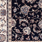 BALUCHI navy area rug close-up of floral scrollwork and cream edge border