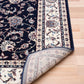 BALUCHI navy area rug showing folded edge and floral stripe border