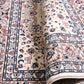 Ivory rug rolled edge showing underside weave and detailed border