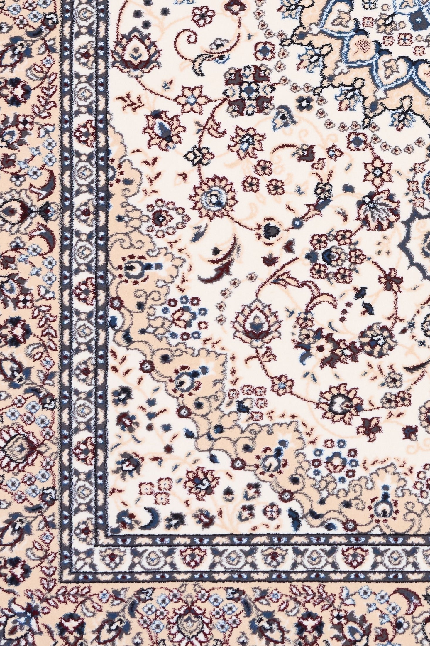 Ivory rug detail with navy and blue border stripes and floral motifs