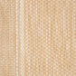 Close-up of beige woven rug texture with fine pattern and light border detail