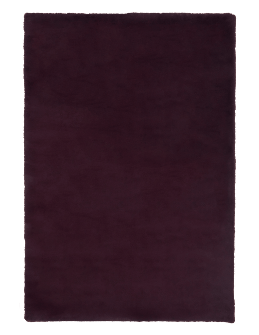 Rectangular dark plum rug with short, dense pile and smooth surface