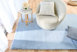 Light blue plush area rug with soft, fuzzy texture