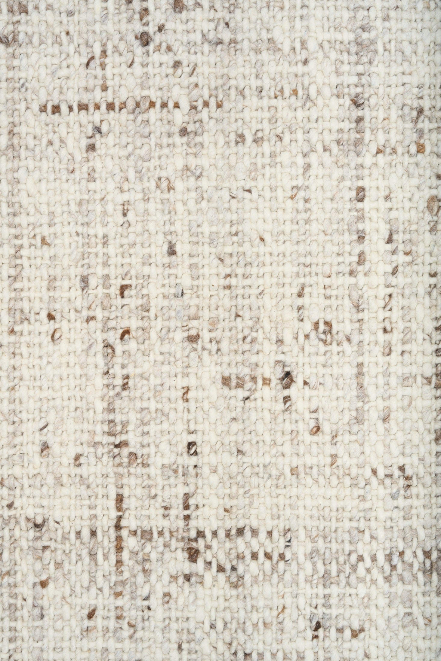 Beige textured rug close-up of speckled woven surface
