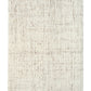 Beige textured area rug with subtle speckled pattern and straight bound edges