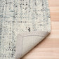 Cleo Blue textured area rug corner with light blue speckled pile and border