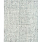 Cleo Blue textured area rug, light blue speckled design centered