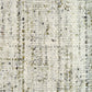 Ivory and light green speckled textured rug surface close-up