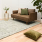 Ivory and light green textured area rug with short pile and speckled design