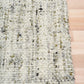 Cleo Green rug with cream, gray, and green speckled woven texture