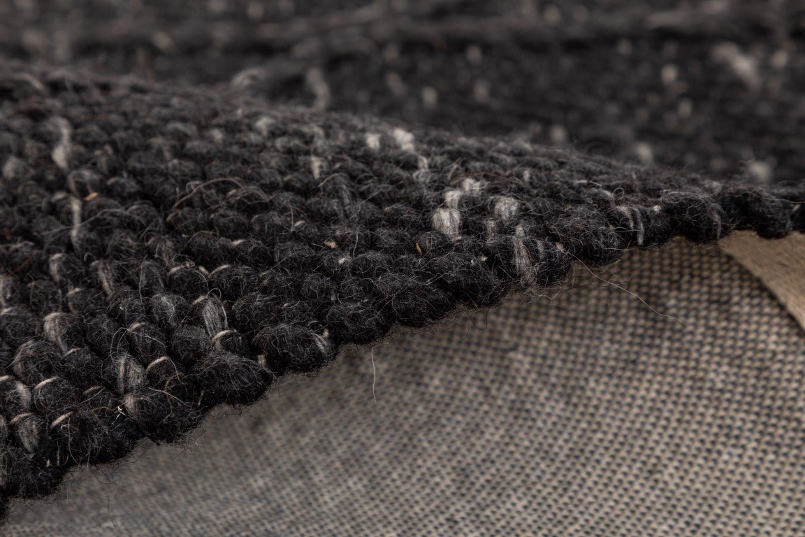Dark wool rug with looped pile texture and beige backing edge visible | Colombo New Zealand Wool Rug Graphite Modern Abstract Wool Area Rug - Rugs Point Australia