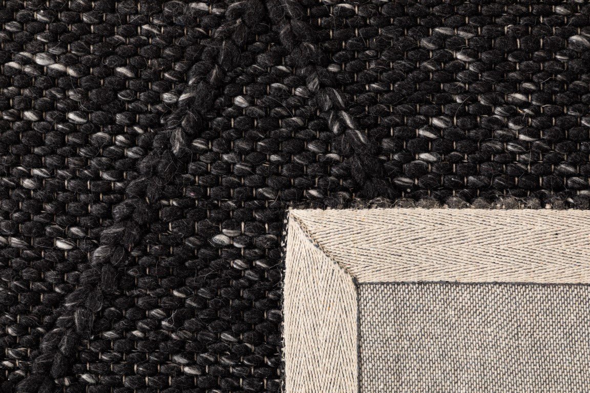 Black wool rug with dense textured weave and beige bound edge detail | Colombo New Zealand Wool Rug Graphite Modern Abstract Wool Area Rug - Rugs Point Australia