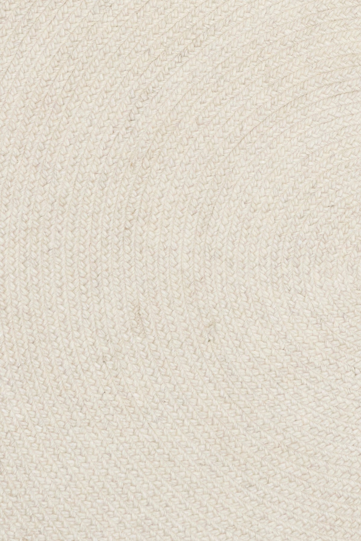 Ivory round rug close-up of tightly woven, raised-texture surface