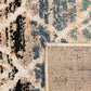 Corner detail of blue and beige rug showing textured pattern and woven border